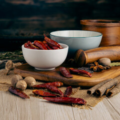 CHINESE CHAOTIAN CHILLI WHOLE on wooden table background. Herbs, spices and dried food baking...