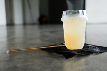 A glass of cold lemon juice mixed with honey. A cool drink is used to quench your thirst during...