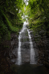 Xiufeng waterfall hidden in the forest, beautiful rocks and plant by the side, in New Taipei City,...