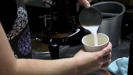 pouring Milk into a cup, milk shop