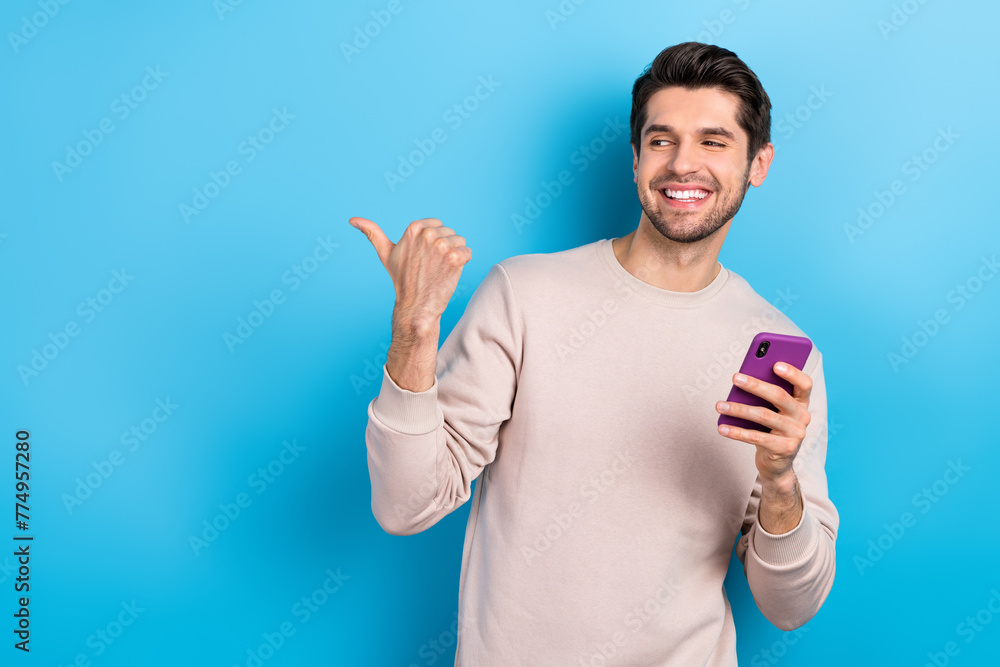 Aufkleber portrait of funny cool man dressed beige sweatshirt hold smartphone directing at online shop empty s