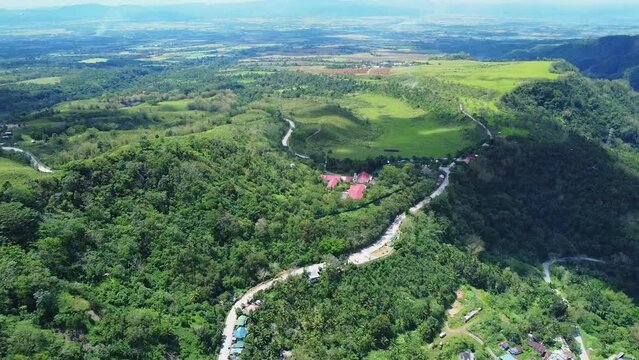 winding road in tropical mountains. Tropical mountain landscape aerial view