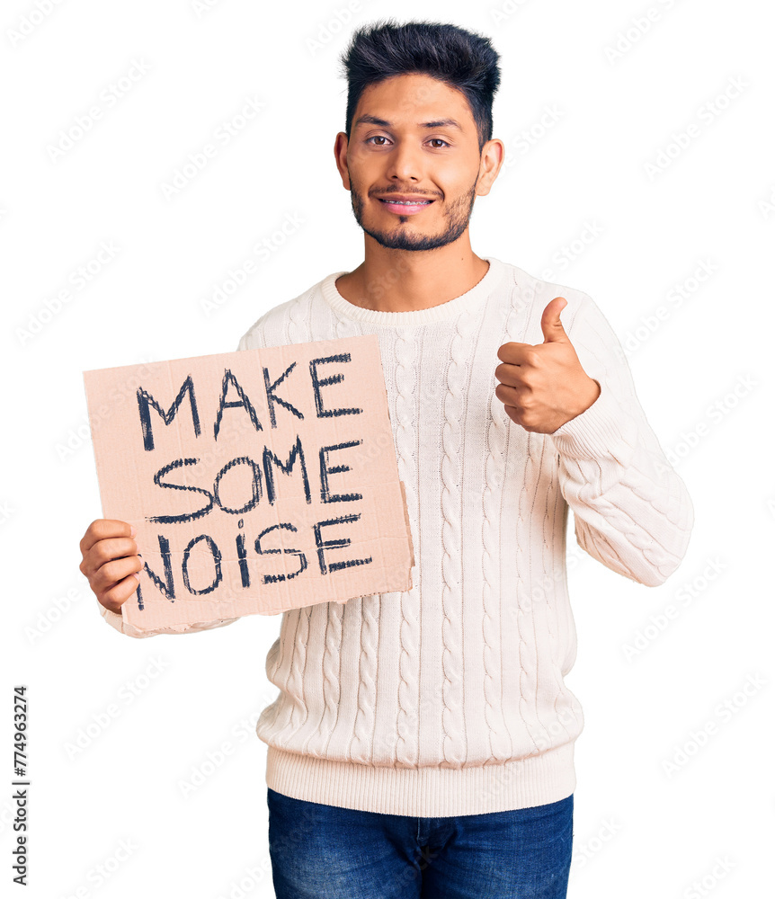 Sticker handsome latin american young man holding make some noise banner smiling happy and positive, thumb u