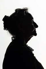 A dark silhouette figure of an elderly woman on white background, with unclear face feature