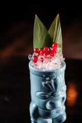 tropical east asian cocktail decorated with bamboo leaves