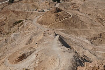 Aerial view of Masada with ancient fortress and rocky mountains in Israel