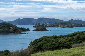 Bay of islands with a charming seascape and beach covered with grass