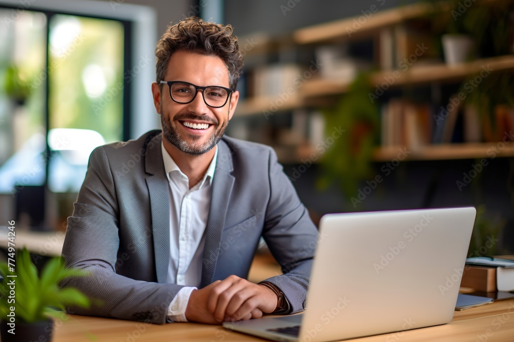 Aufkleber a man in a suit and glasses is sitting at a table with a laptop in front of him. he is smiling and h
