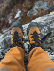 Hiking boots on a rocky mountain trail.