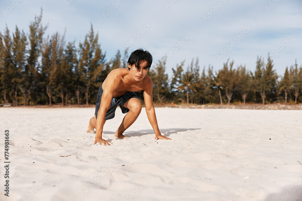 Wall mural Active Asian Athlete: Muscular Man Enjoying Sunset Run on Beach