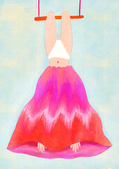 Young girl or woman hanging upside down on an acrobats swing with a colorful skirt over her head, upside down girl