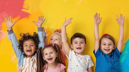 International Children's Day, happy children smile and raise their hands up, yellow background