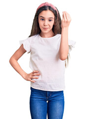 Obraz na płótnie Canvas Cute hispanic child girl wearing casual white tshirt doing italian gesture with hand and fingers confident expression