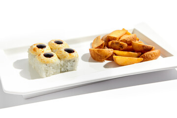 Japanese cuisine combination of baked sushi rolls and golden wedges, elegantly presented on a sleek white plate with a white background