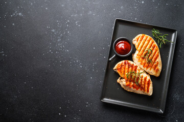 Grilled Chicken meat on black background.