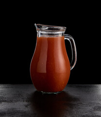 Strawberry lemonade in jar on black background. Summer non-alcoholic cocktail with berries on black...