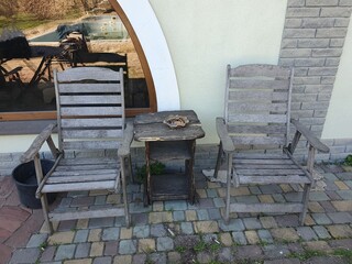 
Wooden chairs near the house. Beautiful chairs for relaxing.