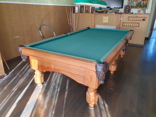 
Pool table indoors. Empty billiard table.