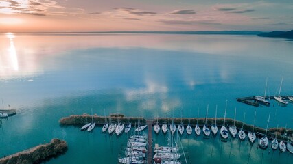 Aerial view of a port with a tranquil seascape at sunset