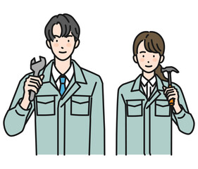 工具を持つ作業服姿の男性と女性（上半身）