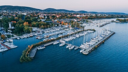 Aerial view of a port with moored yachts and boats - obrazy, fototapety, plakaty