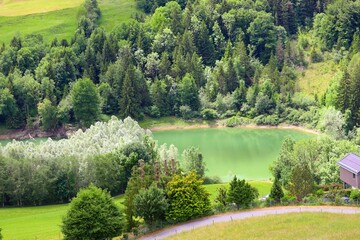 Scenic shot of Furnas Lake surrounded by greenery in Portugal