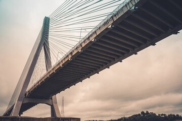 Low-angle of the Anzac bridge against cloudy sky