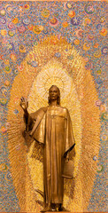MILAN, ITALY - MARCH 8, 2024: The bronze statue of St. John the Evangelist in the church Chiesa di Santi Quattro Evangelisti by Mario Zappettini from 20. cent. - 775023253