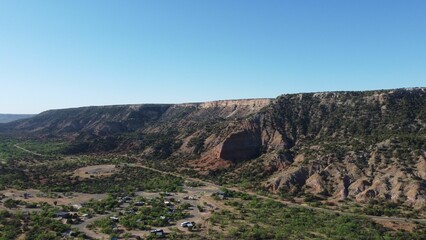 Aerial view of a canyon park with geological formations in Texas in blue sky background