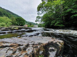 Beautiful shot of a clear river with a town in the distance