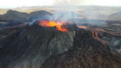 Landscape of lightening erupting Mauna Loa Volcano in Hawaii with smoke and hazy sky