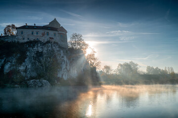 Morning near Krakow, Tyniec, Poland. In the foreground the river and the morning fog, in the background the Benedictine Abbey in Tyniec. - obrazy, fototapety, plakaty