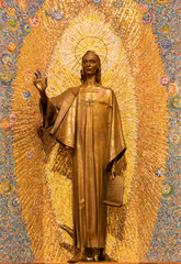 MILAN, ITALY - MARCH 8, 2024: The bronze statue of St. John the Evangelist in the church Chiesa di Santi Quattro Evangelisti by Mario Zappettini from 20. cent. - 775032446