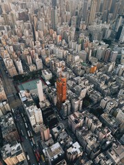 Vertical shot of the modern city buildings in Kowloon area. Hong Kong. View from a drone.