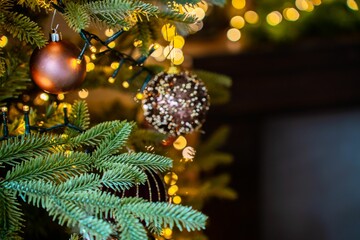 Sparkly Christmas background displaying the glittery Christmas tree decorations and bokeh lights