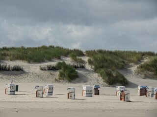Strandkorbs, special hooded windbreak seating furniture captured along a beach