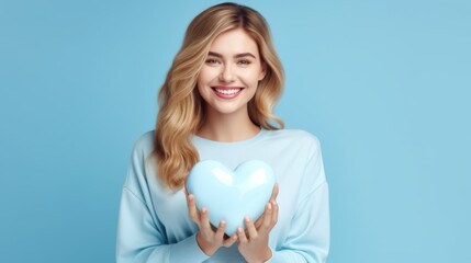 Obraz na płótnie Canvas A Woman Holding Blue Heart