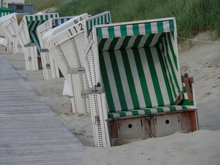 Closeup shot of a booth on a white sand beach.