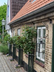 Vertical shot of the exterior of a vintage stone house in Schleswig-Holstein, Germany