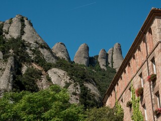 Abbey of Montserrat on the mountain of Montserrat in Catalonia, Spain with trees