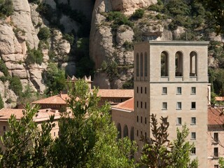 Abbey of Montserrat on the mountain of Montserrat in Catalonia, Spain with trees