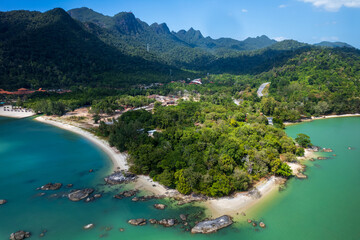 Blue ocean with a green shoreline and a mountain in the background, Pantai Kok, Langkawi,Malaysia - 775039891