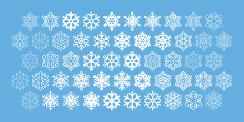 A set of vector snowflakes with different shapes and styles isolated on blue background