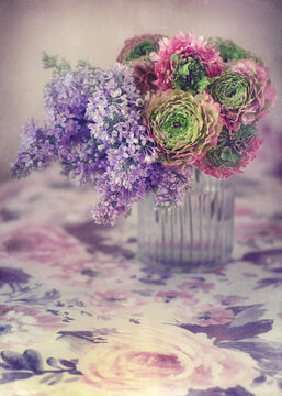 Beautiful bouquet of spring flowers in a vase on the table. Lovely bunch of flowers .
