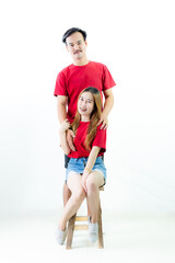 Fototapeta na wymiar Young Asian couple isolated on white background,Young attractive Asian couple wearing red t shirt and white shorts standing together, woman holding bouquet of flower against white background. Concept 