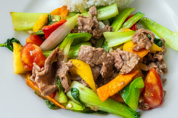 Stir frying beef with sweet peppers and bok choy. Spicy beef with vegetables. Asian style food. Top view - obrazy, fototapety, plakaty