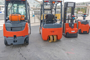 Four Forklift Trucks Gas and Electric Powered Vehicles
