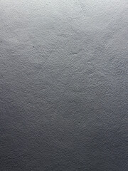 Photograph of a gray cement patterned wall