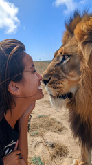 Photo of Lion making eye contact with a woman