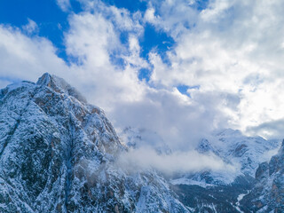 italian alps dolomites and surrounding characteristic mountains clouds fog castle church - obrazy, fototapety, plakaty